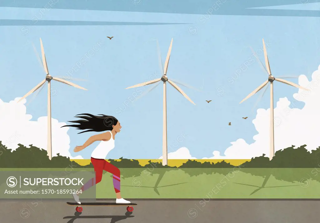 Carefree woman skateboarding along wind turbines in sunny field