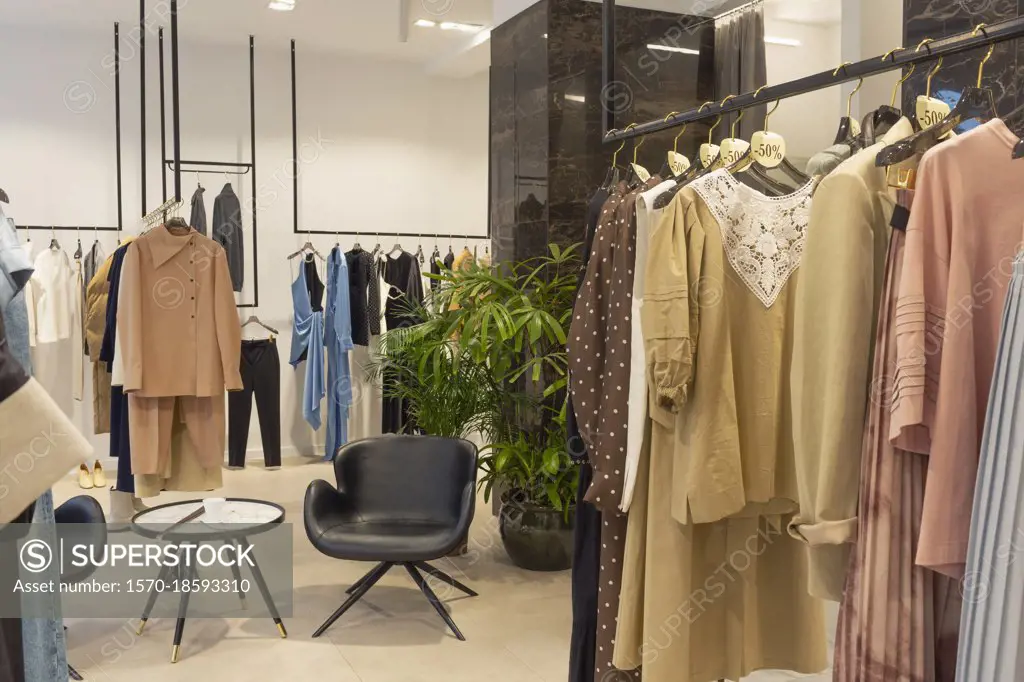 Clothing on racks in boutique