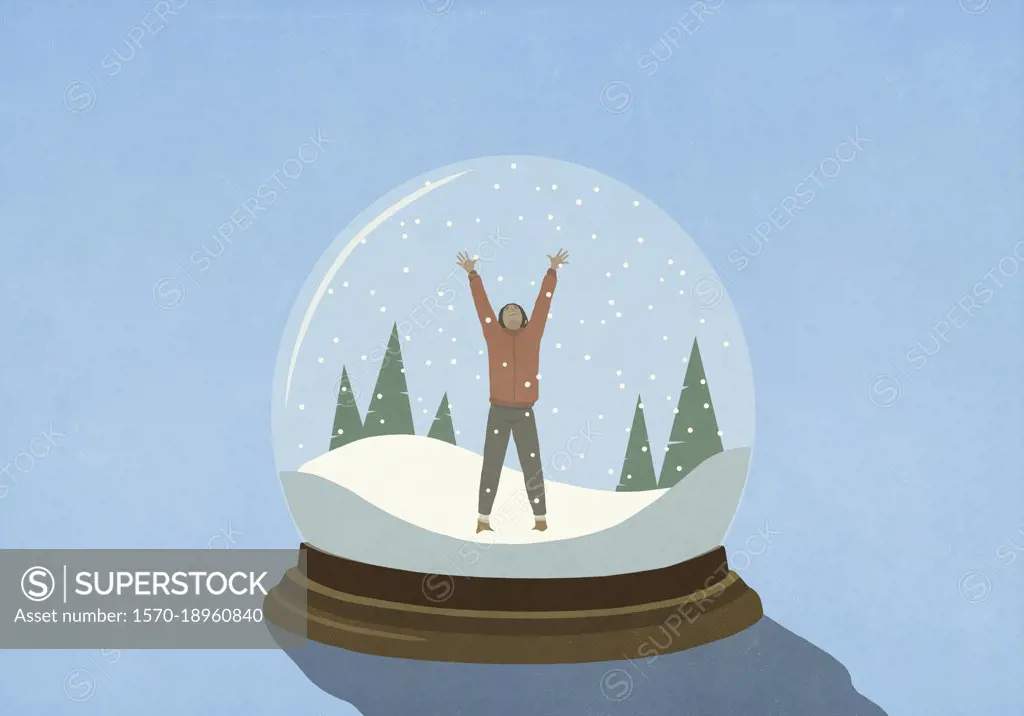 Woman with arms raised inside snow globe