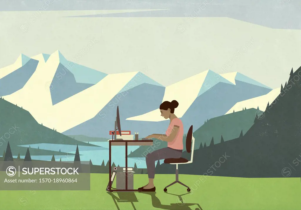 Businesswoman working at desk in idyllic mountain meadow
