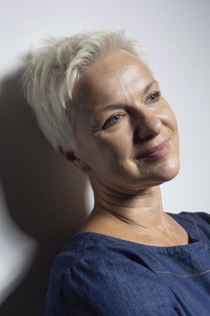 Portrait beautiful mature woman with short hair smiling