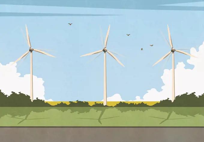 Wind turbines spinning in sunny idyllic rural field