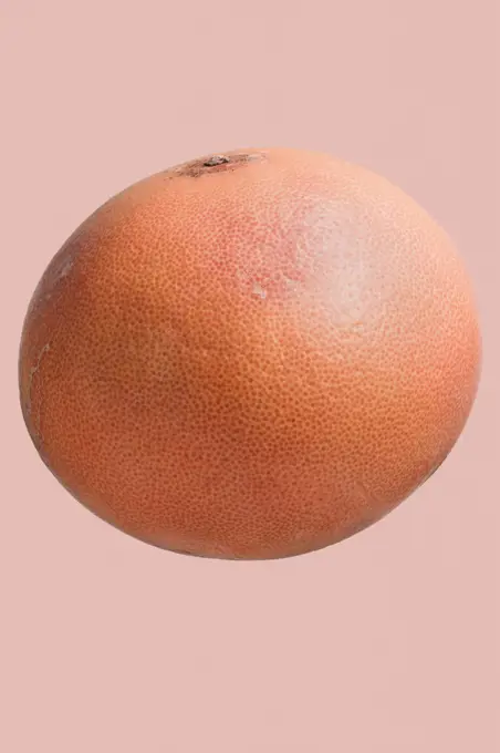 Extreme close up dimples on whole grapefruit