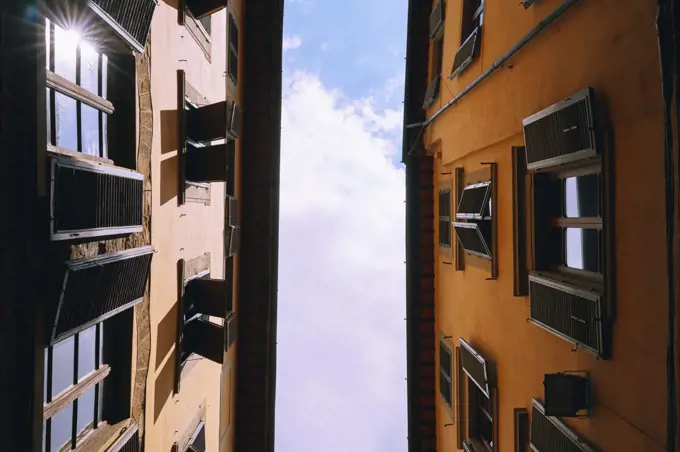 View from below apartment buildings, Florence, Tuscany, Italy