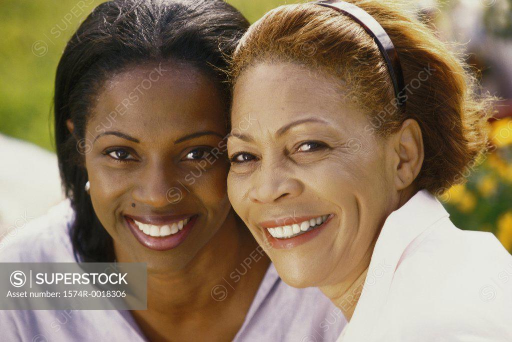 Stock Photo: 1574R-0018306 Portrait of a mother smiling with her daughter