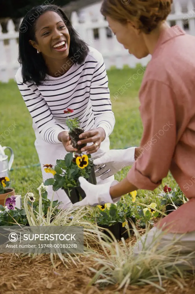 Mother gardening with her daughter