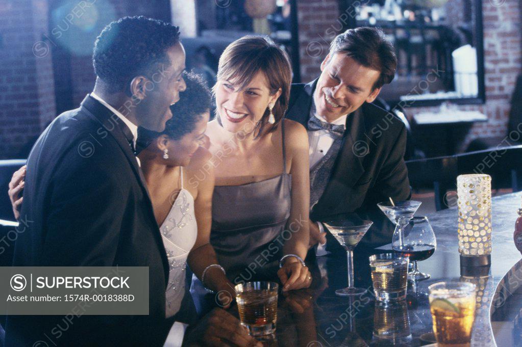 Stock Photo: 1574R-0018388D Two young couples together in a bar