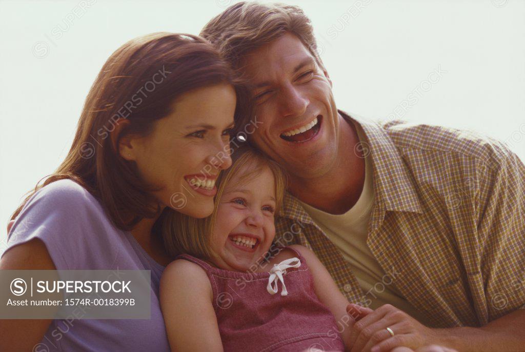 Stock Photo: 1574R-0018399B Close-up of parents and their daughter laughing