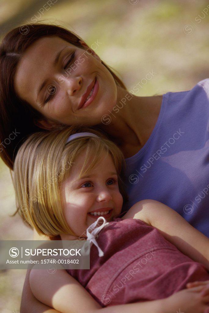Stock Photo: 1574R-0018402 Close-up of a daughter sitting on her mother's lap
