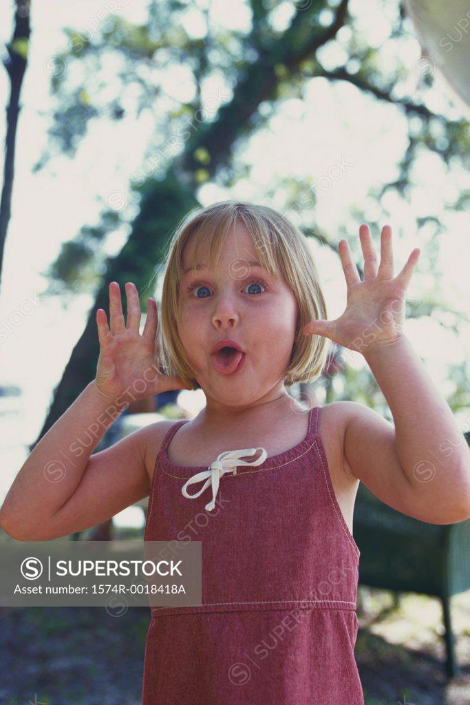 Stock Photo: 1574R-0018418A Portrait of a girl making a face