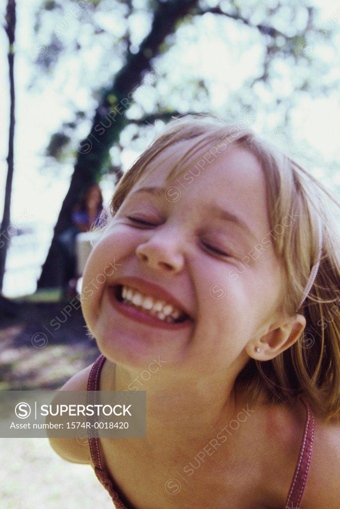 Stock Photo: 1574R-0018420 Close-up of a girl smiling with her eyes closed