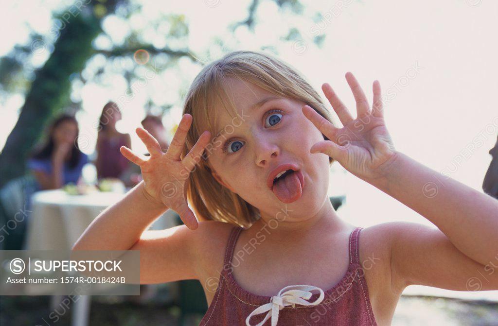 Stock Photo: 1574R-0018424B Portrait of a girl making a funny face