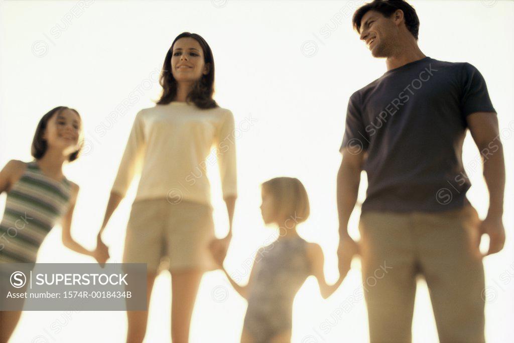 Stock Photo: 1574R-0018434B Low angle view of parents standing with their two daughters