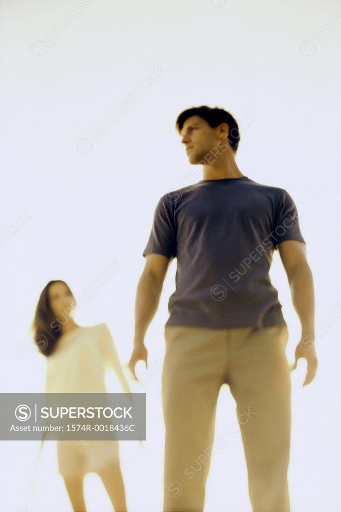 Stock Photo: 1574R-0018436C Low angle view of a young couple standing