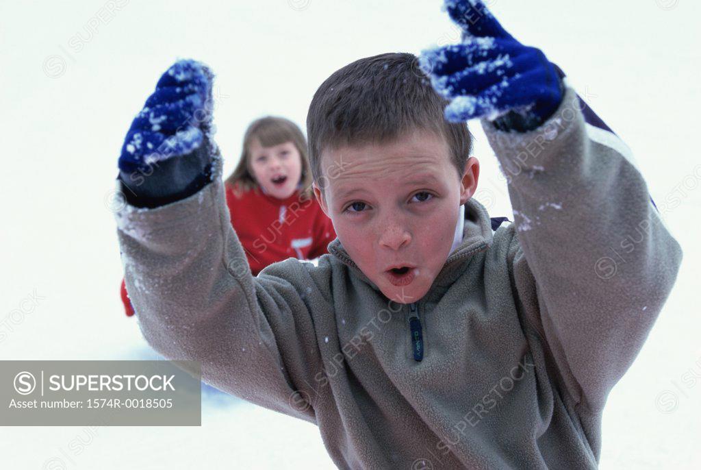 Stock Photo: 1574R-0018505 Close-up of a boy playing with snow