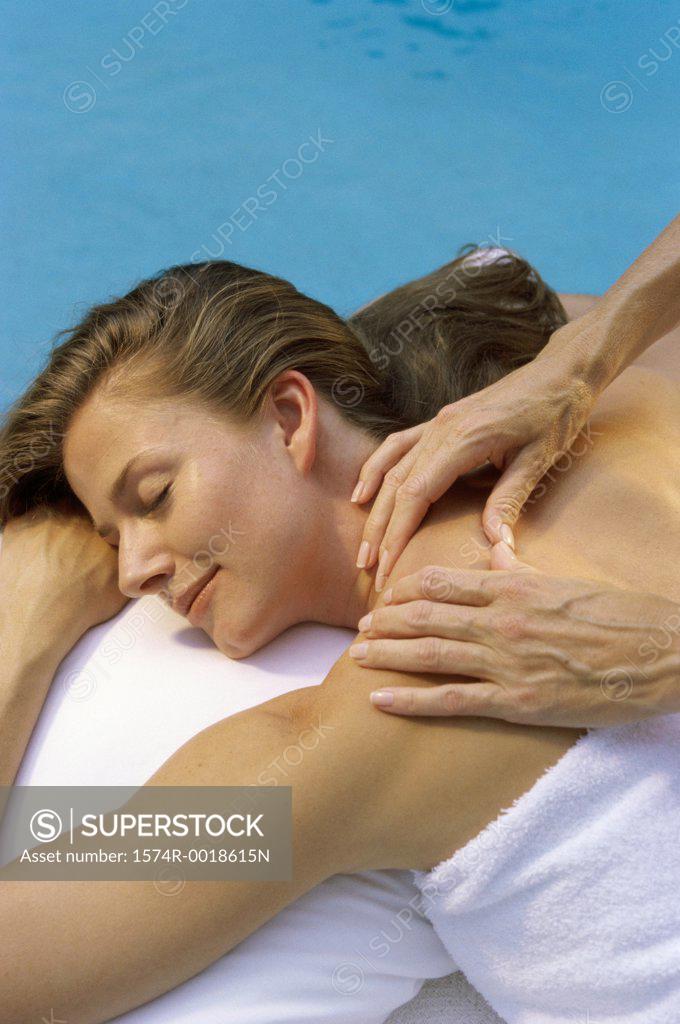 Stock Photo: 1574R-0018615N Rear view of a young woman getting a back massage