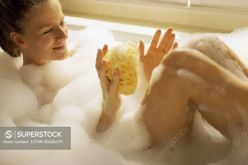 High angle view of a young woman in a bathtub