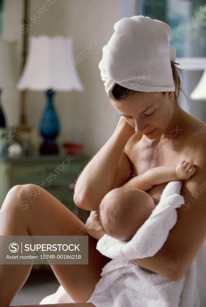 Stock Photo: 1574R-0018621B Mother breastfeeding her baby girl
