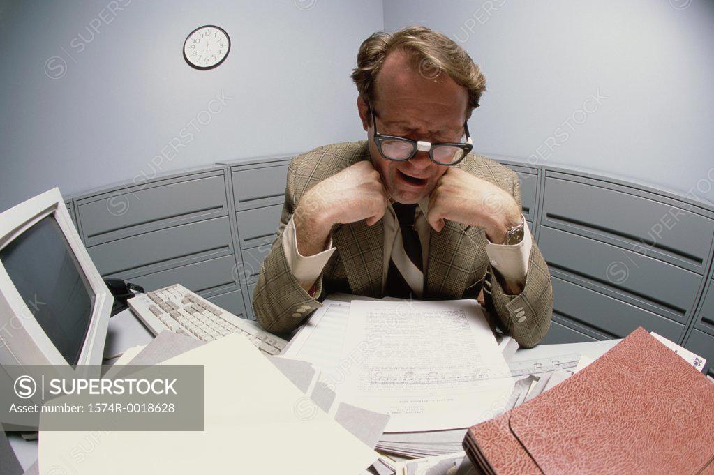 Stock Photo: 1574R-0018628 Close-up of a businessman reading a document