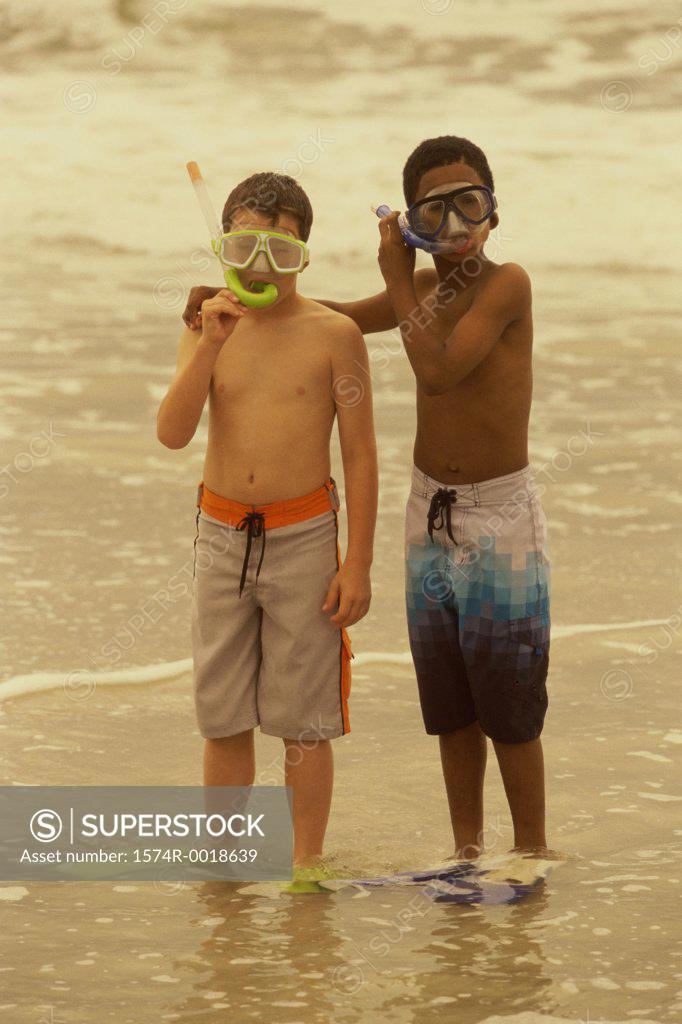 Stock Photo: 1574R-0018639 Portrait of two boys wearing snorkel masks on the beach