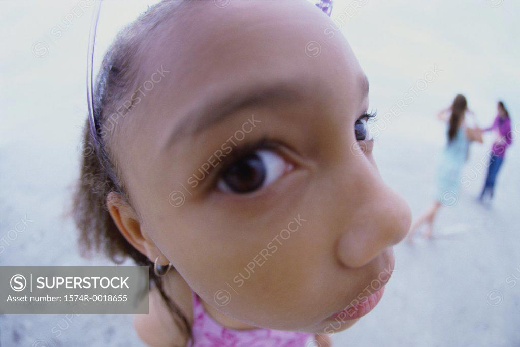 Stock Photo: 1574R-0018655 Close-up of a girl standing on the beach
