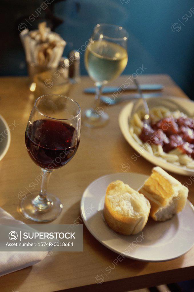 Stock Photo: 1574R-0018684 Close-up of food with two glasses of wine on a table