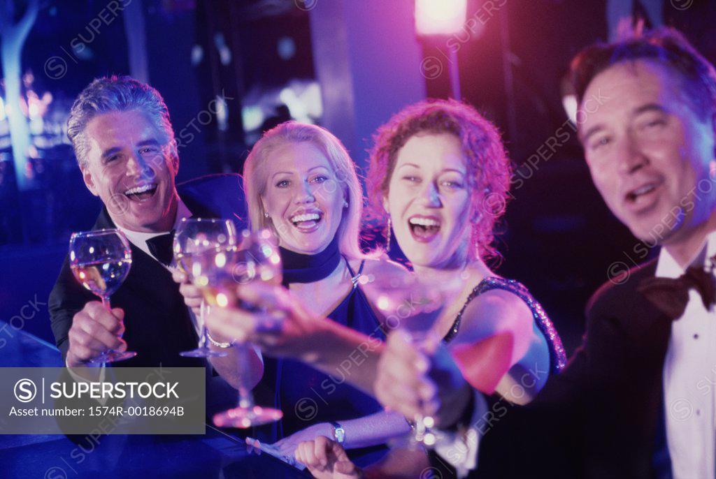 Stock Photo: 1574R-0018694B Portrait of two couples holding wine glasses