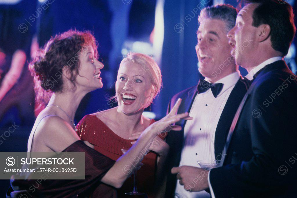 Stock Photo: 1574R-0018695D Two couples laughing