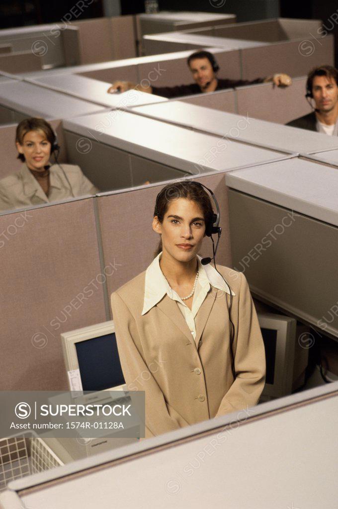 Stock Photo: 1574R-01128A Portrait of customer service representatives in cubicles