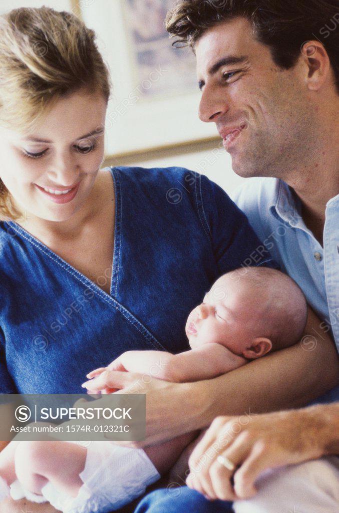 Stock Photo: 1574R-012321C Close-up of parents holding their son
