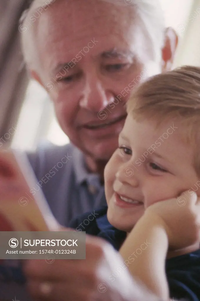 Close-up of a grandfather smiling with his grandson