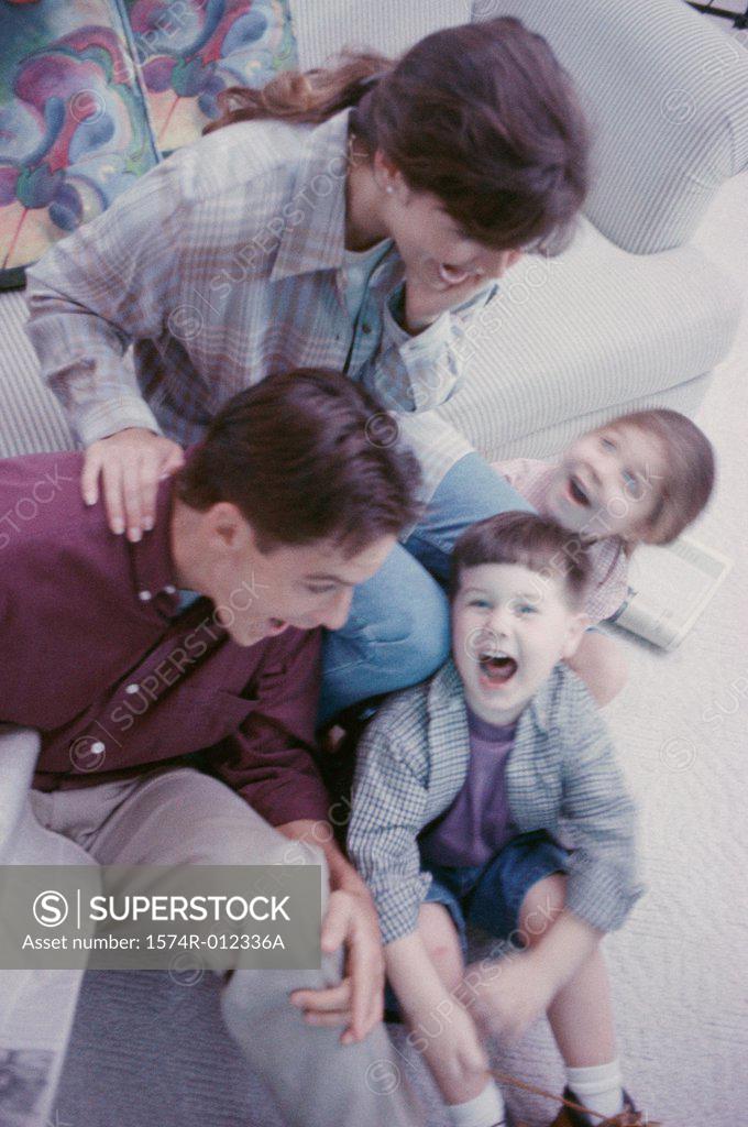 Stock Photo: 1574R-012336A High angle view of parents with their son and daughter laughing