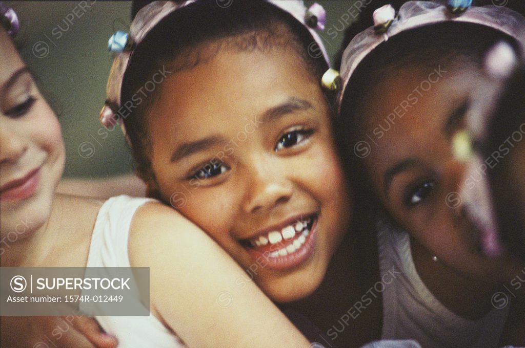 Stock Photo: 1574R-012449 Close-up of three ballet dancers smiling