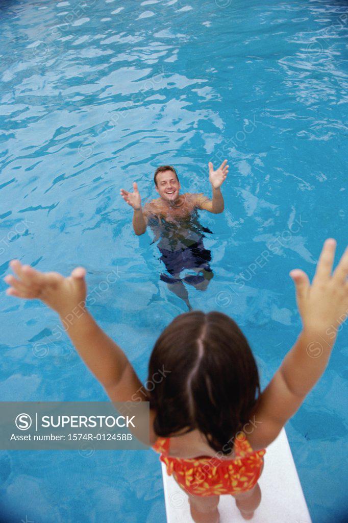 Stock Photo: 1574R-012458B Girl standing on a diving board