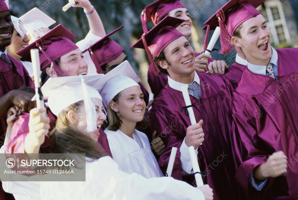 Stock Photo: 1574R-012466A Group of teenage graduates celebrating
