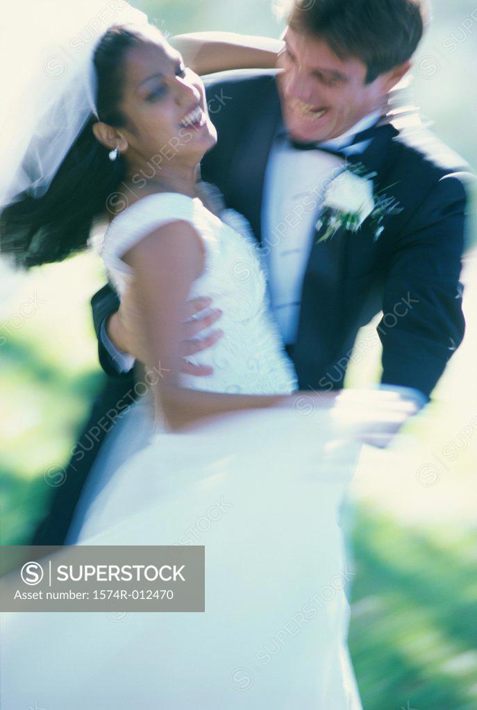 Stock Photo: 1574R-012470 Newlywed couple dancing
