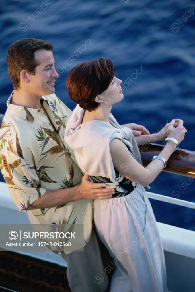 Stock Photo: 1574R-012568 High angle view of a mid adult couple standing on the deck of a cruise ship