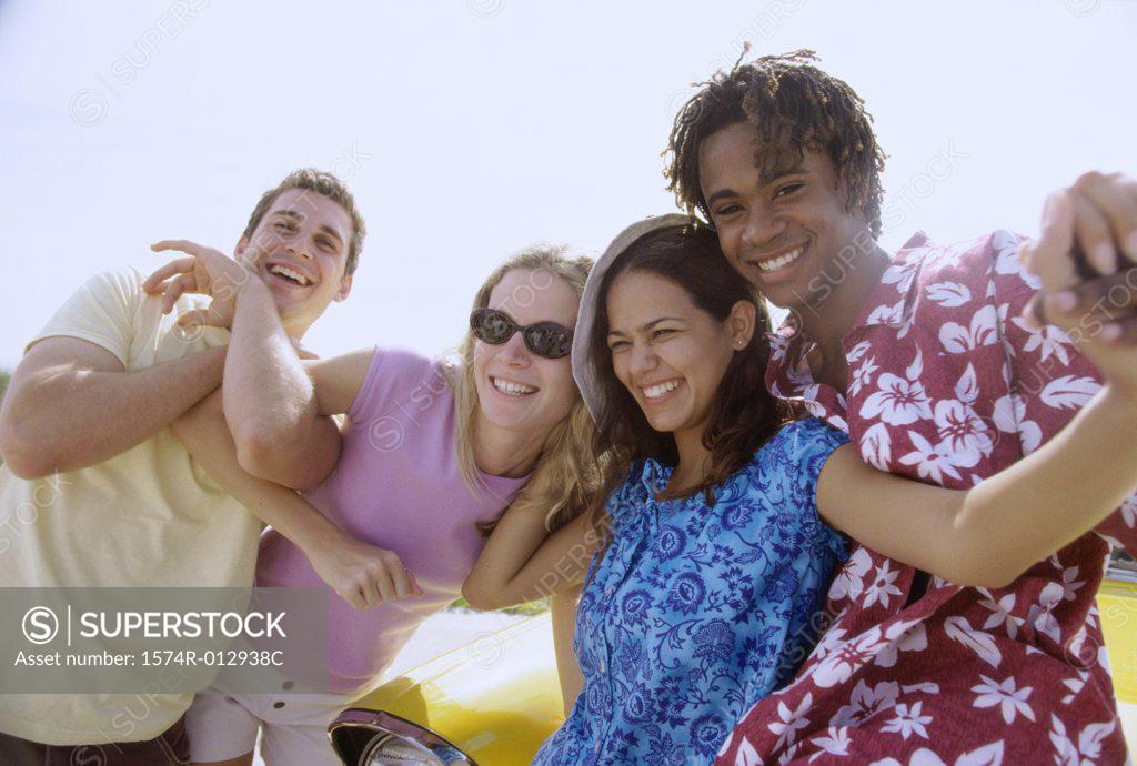 Stock Photo: 1574R-012938C Close-up of four teenagers smiling