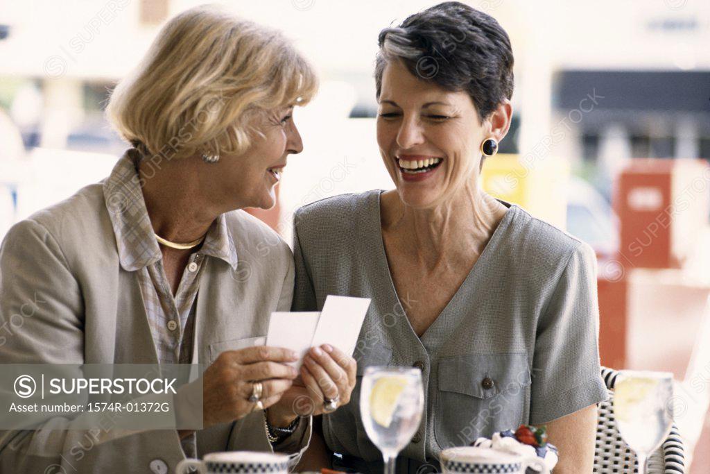 Stock Photo: 1574R-01372G Two women sitting together in a cafe