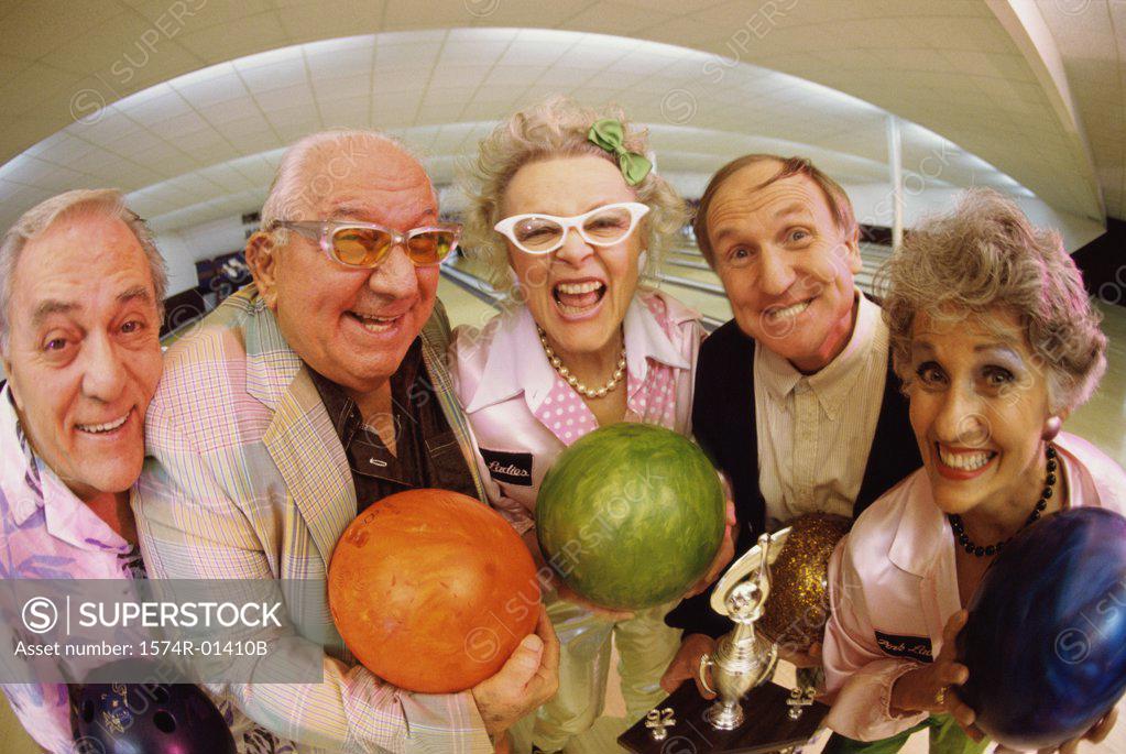Stock Photo: 1574R-01410B Portrait of a bowling team in a bowling alley