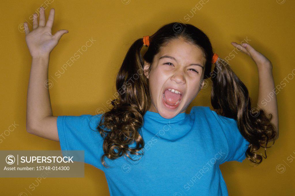 Stock Photo: 1574R-014300 Portrait of a girl screaming