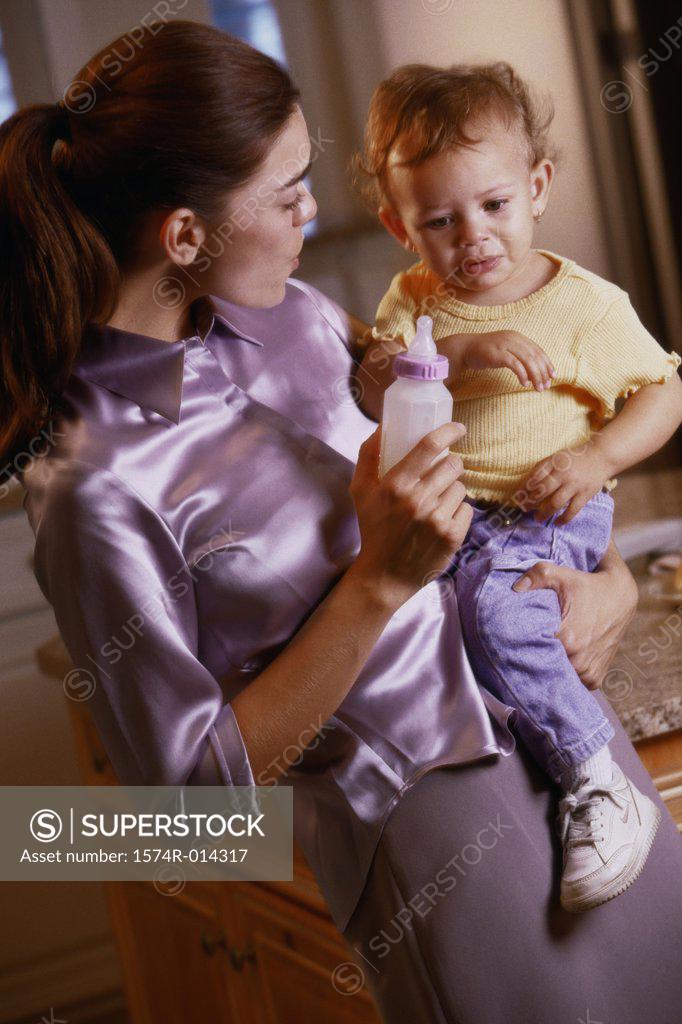 Stock Photo: 1574R-014317 Close-up of a mother consoling her crying son
