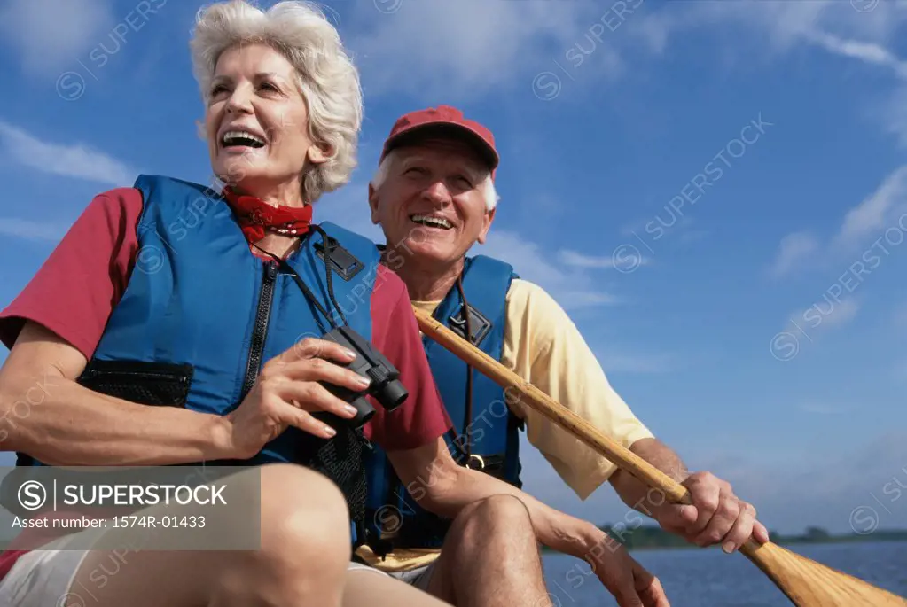 Low angle view of a senior couple in a row boat