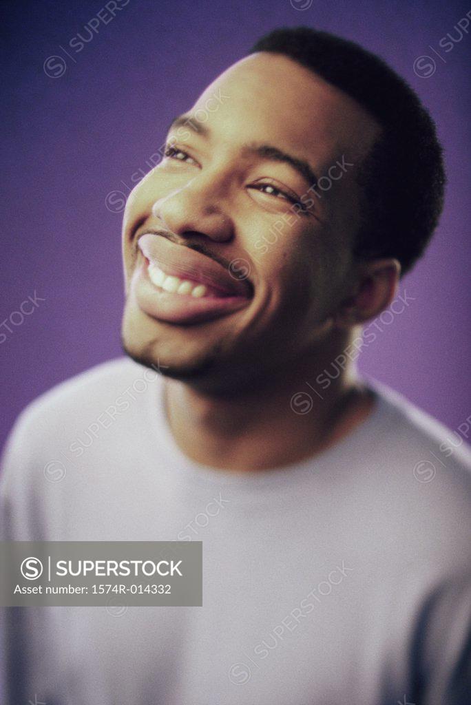 Stock Photo: 1574R-014332 Close-up of a young man smiling