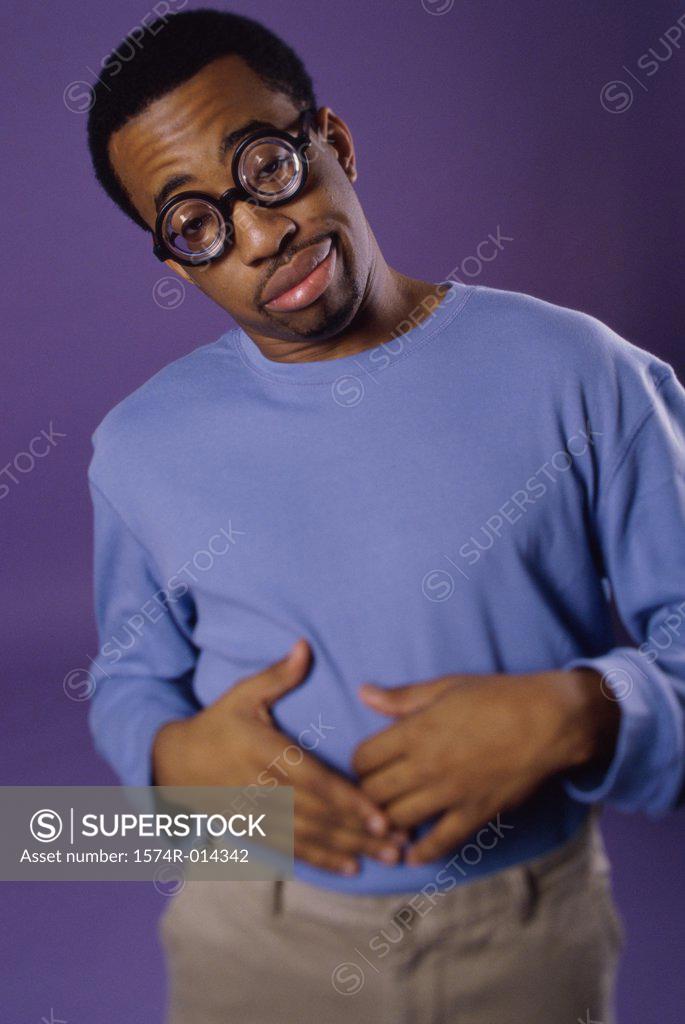 Stock Photo: 1574R-014342 Portrait of a young man with an upset stomach