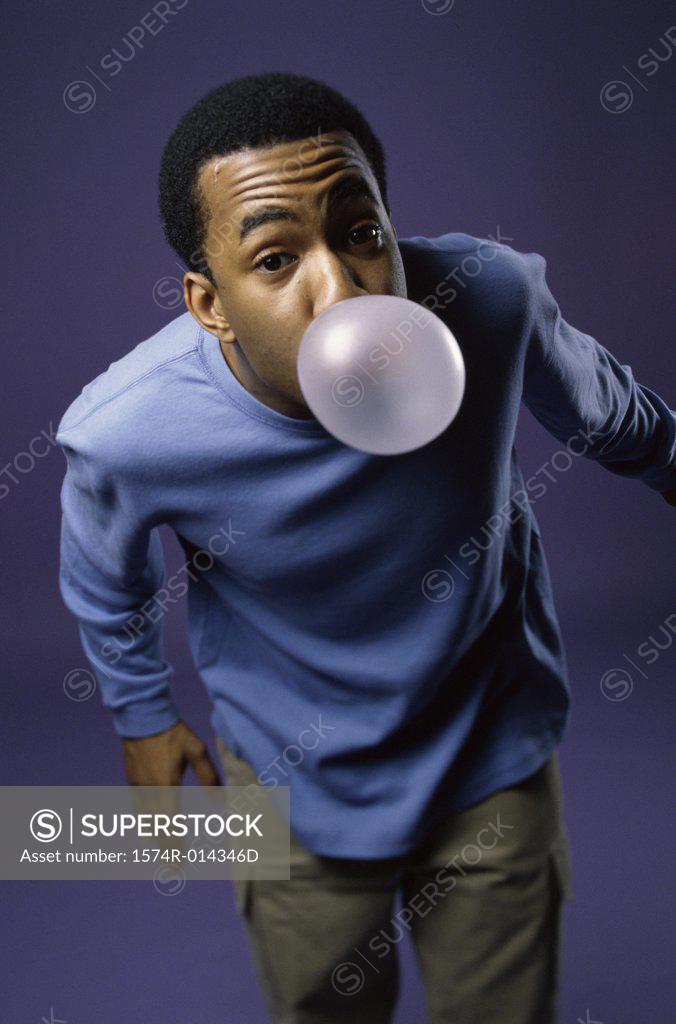 Stock Photo: 1574R-014346D Portrait of a young man blowing a bubble