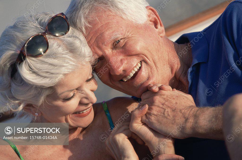 Stock Photo: 1574R-01434A Senior couple holding hands