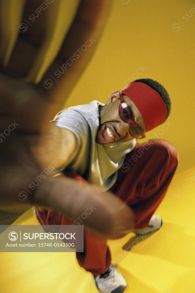 Stock Photo: 1574R-014350G Portrait of a young man showing a stop gesture