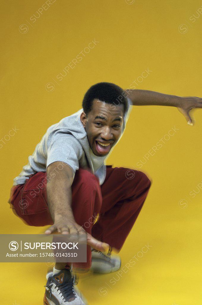 Stock Photo: 1574R-014351D Side profile of a young man showing a stop gesture