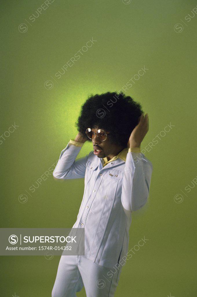 Stock Photo: 1574R-014352 Young man with his hand in his hair